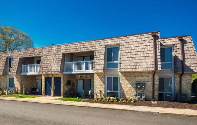 a building with a street in front of it  at Bayville Apartments, Virginia Beach, VA, 23455