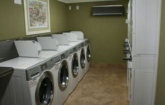 a washer and dryer are in a laundry room