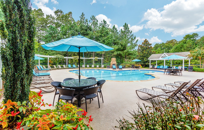 View of Pool Area, Showing Picnic Area, Loungers, and Cabana at Summer Park Apartments