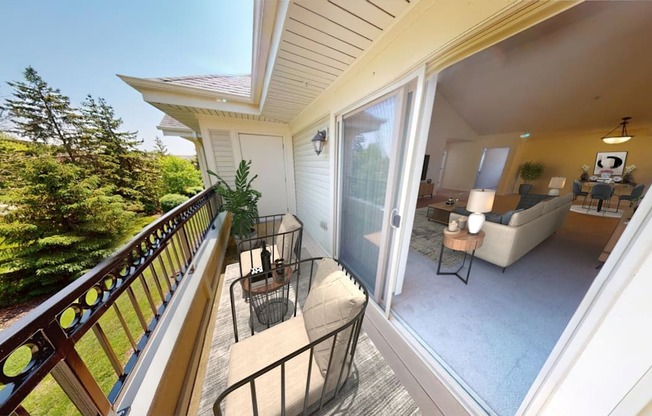 a patio with a table and chairs on a balcony