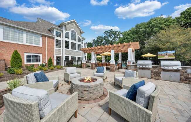 the estates at tanglewood|furnished patio with fire pit and seating area