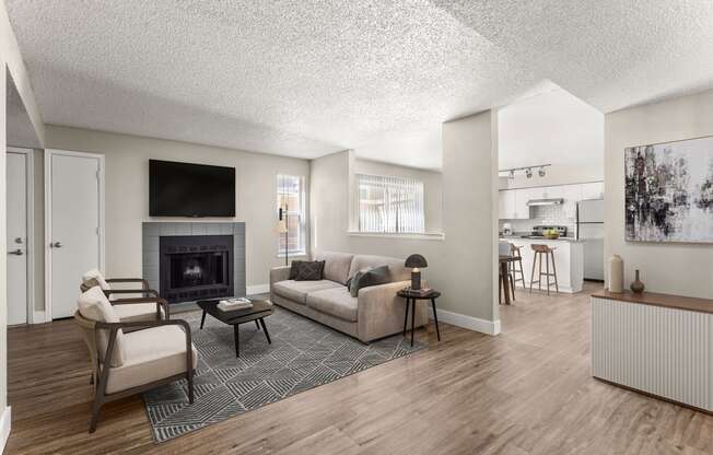 a living room with a couch and chairs and a fireplace at Arcadia Apartments, Colorado, 80112