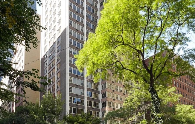 a tall building on the corner of a city street