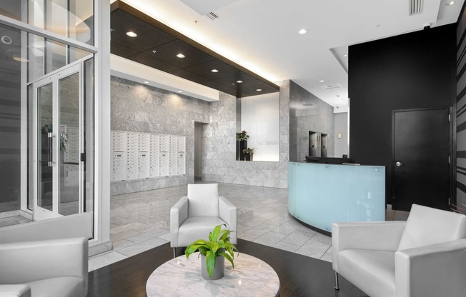 a lobby with a reception desk and chairs