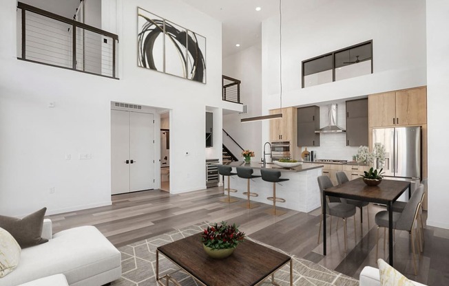 a living room with a kitchen and a dining room