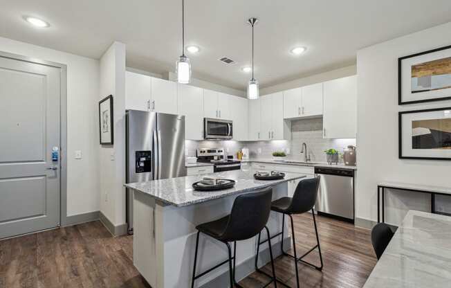 the residence apartment homes offers a spacious kitchen with stainless steel appliances at LynnCora, Texas, 75052