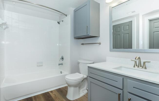 a room with a sink and a mirror