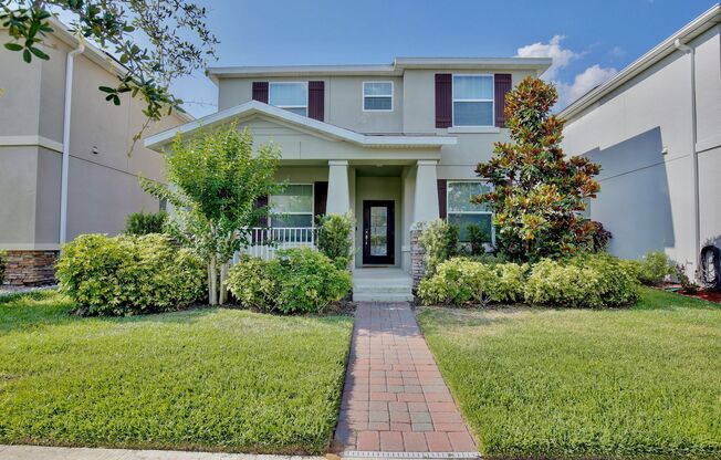 Luxurious 5/3 Modern Home with a Screened Patio and a 2 Car Garage in the Highly Desirable Storey Park - Orlando!