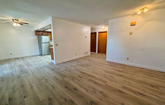 Centrally located beautiful second story condo in quiet community with vinyl plank flooring and beautiful custom showers!
