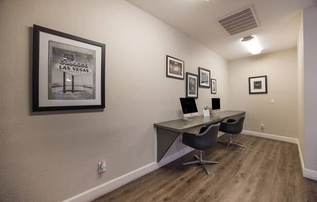 Computer center with a computer desk and a picture on the wall at 2900 Lux Apartment Homes, Nevada