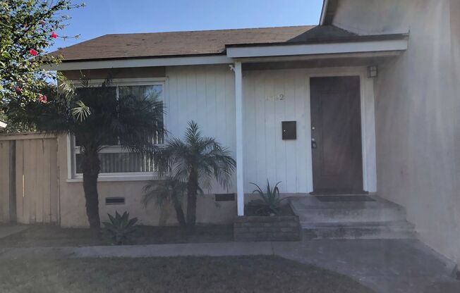 4 bed 2 bath house with large backyard, 2 car garage & laundry hook ups