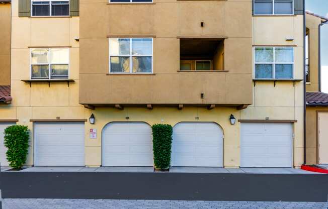 a street view of a building with garage doors