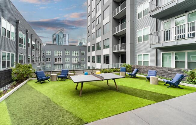 The 4th Floor Terrace at Modera Old Ivy invites relaxed afternoons with lawn games, lounge seating, and skyline glimpses woven into everyday Atlanta living.