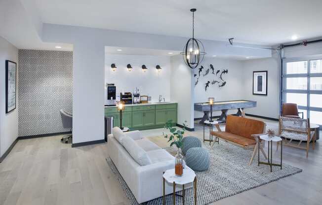 a living room with white walls and hardwood floors