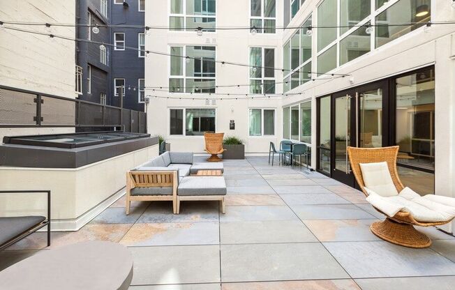 Outdoor lounge with patio furniture at TL Residences