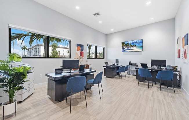 a modern office with desks and chairs and a window