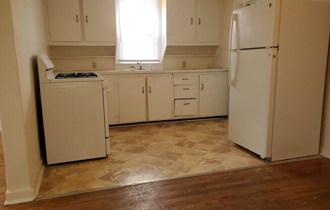 2 bd, 1 ba house, hardwoods, new paint, fenced with shed, w/d included, mowing provided, north central location near Business Loop