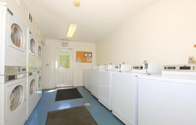 Laundry facility equipped with washers and dryers at Rainbow Ridge Apartments in Kansas City, Kansas