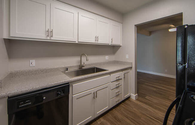 Unfurnished Living Room With Wood Flooring, Sliding Glass Door, and a Ceiling Fan at Aspire Upland Apartments, Upland, CA, 91786