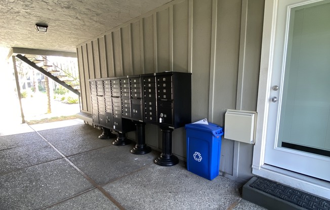 a row of refrigerators sit outside of a building