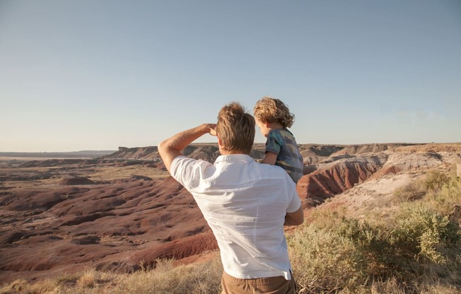 Dad and child near Senna at Canyon Trails Apartments