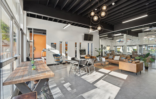 Community Clubhouse with Lounge Furniture and TV at Horizon Apartments located in Santa Ana, CA.