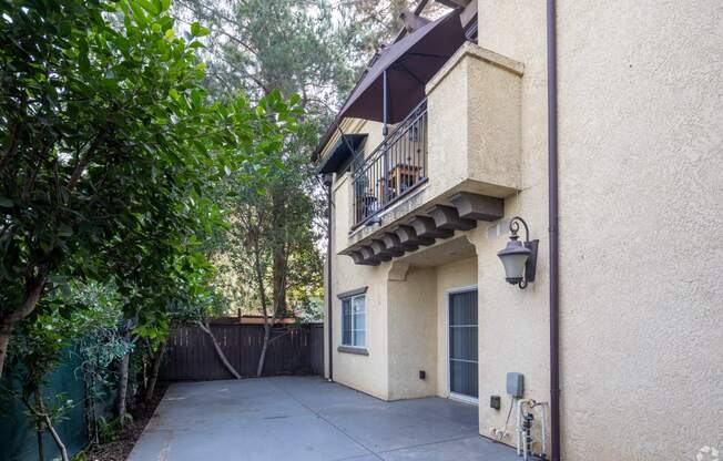 a view of the back of the house from the driveway at The Village Apartments, Van Nuys, CA