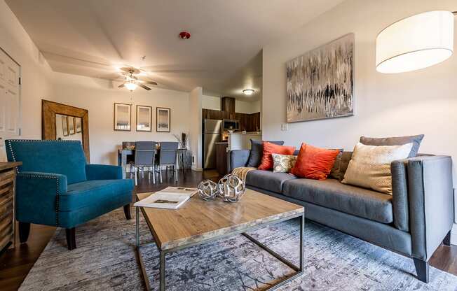 living room with couch, coffee table, and chair