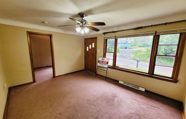 "Cozy 3-Bedroom with Carport & Basement: Your home Awaits!