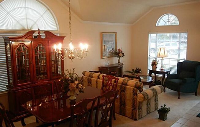 This meticulously maintained, smoke-free home offers an exceptional layout with soaring high ceilings, extensive tile flooring, and fresh neutral paint throughout.