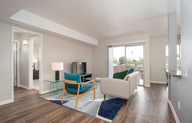 TV, Sofa In Living Room at Los Robles Apartments, Pasadena, CA, 91101