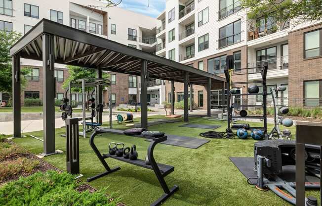 our apartments have a gym with equipment and apartments in the background