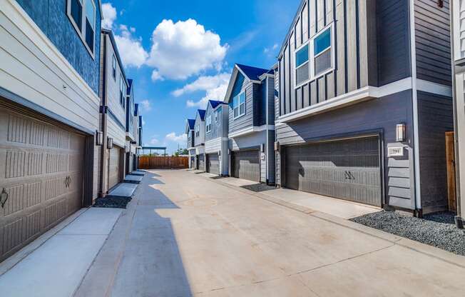 a row of townhomes with a blue sky in the background