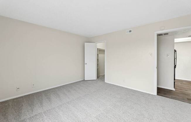 A2 bedroom with carpet and door at Westdale Pointe in Austin, TX