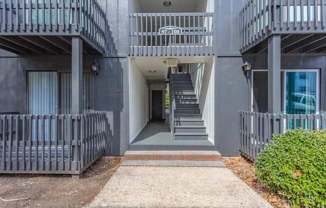 A building with a staircase leading to the entrance.