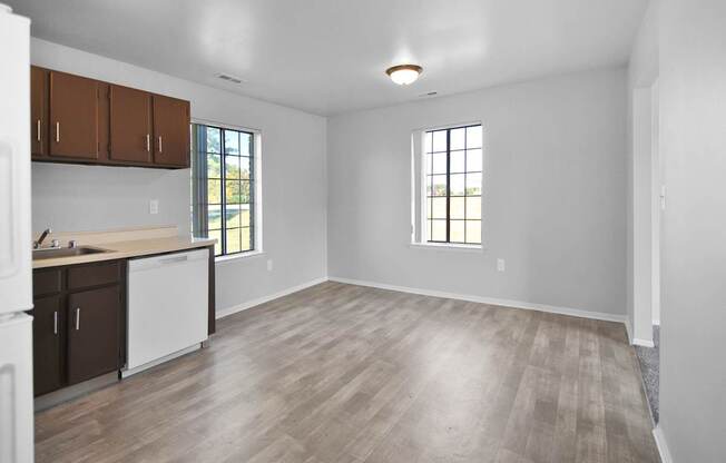 Fully equipped apartment kitchen with modern appliances at Farmbrooke Manor Clinton Township MI