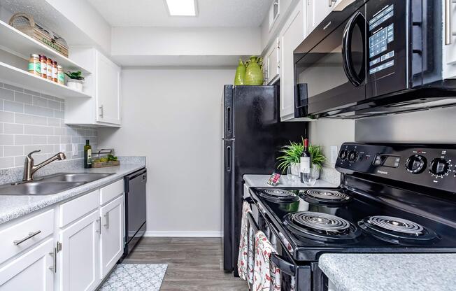a stove top oven sitting inside of a kitchen