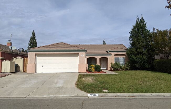 4 bedroom home in NE Fresno offering an open floor plan with a living room and family room + Clovis Schools.