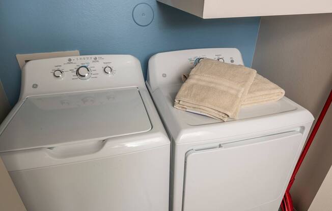 Two white washing machines at Woodbridge Villas Apartments, Sachse, Texas