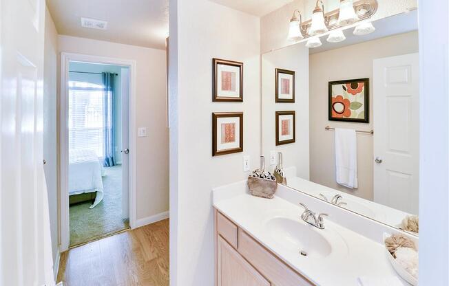 Mirrored vanity bathroom at Bentley Place at Willow Bend Apartments in West Plano, TX, For Rent. Now leasing 1, 2, and 3 bedroom apartments.