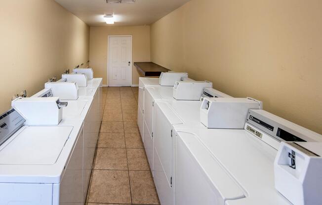 a kitchen with a sink and a refrigerator