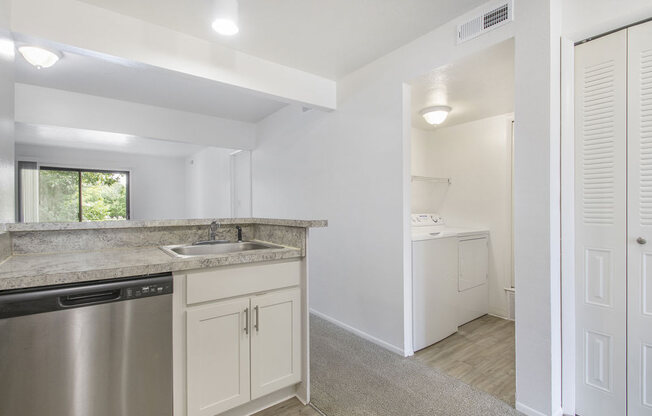 a kitchen view of a laundry room at North Pointe Apartments in Elkhart, IN
