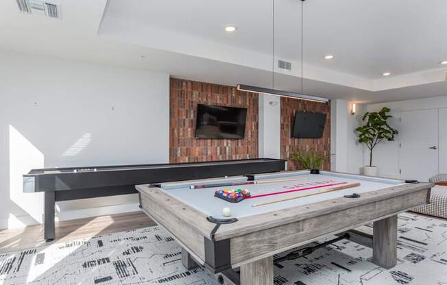 Gaming lounge with pool table and shuffle board