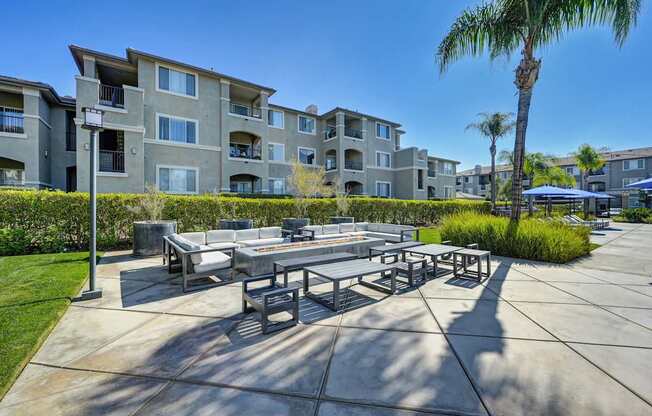 A sunny day at the outdoor seating area of a residential building.
