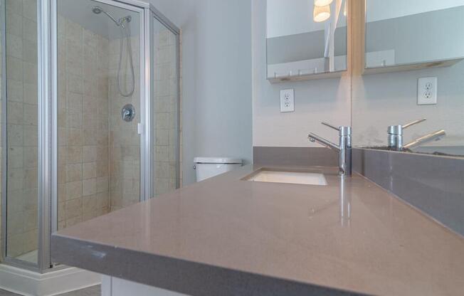 a bathroom with a sink and a shower at Warner Center Townhomes, Canoga Park California