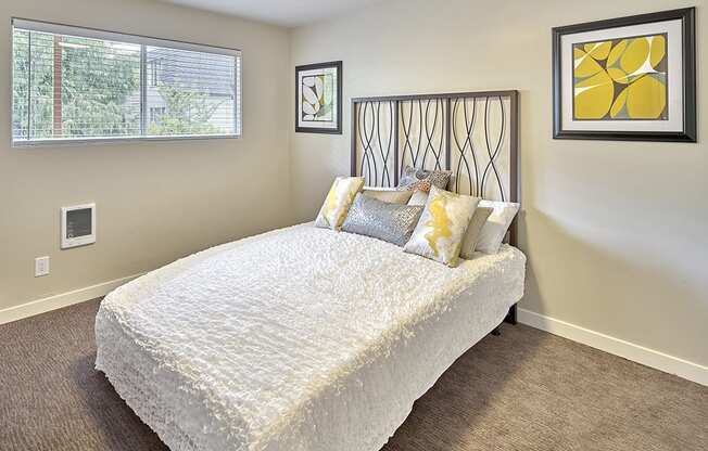 a bedroom with a bed and two windows  at 3030 Lake City, Seattle