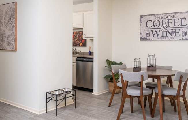 a dining room with a table and chairs and a sign that reads coffee and wine