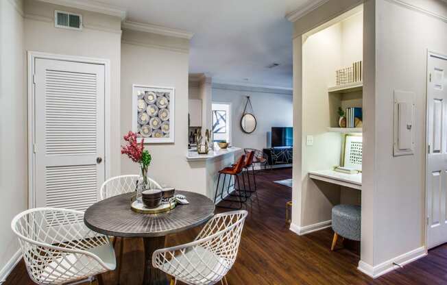 a living room and dining room with a table and chairs at Carrington at Barker Cypress, Texas, 77433