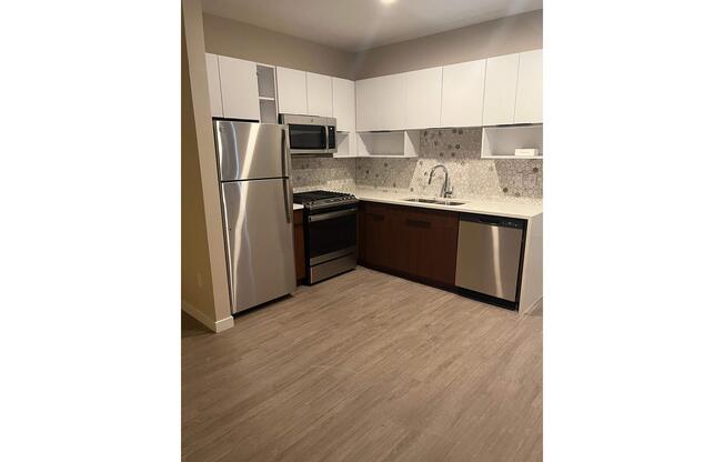 a stainless steel refrigerator in a kitchen