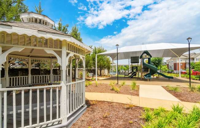 a gazebo with a playground in a park at Vineyard of Olive Branch in Olive Branch, MS